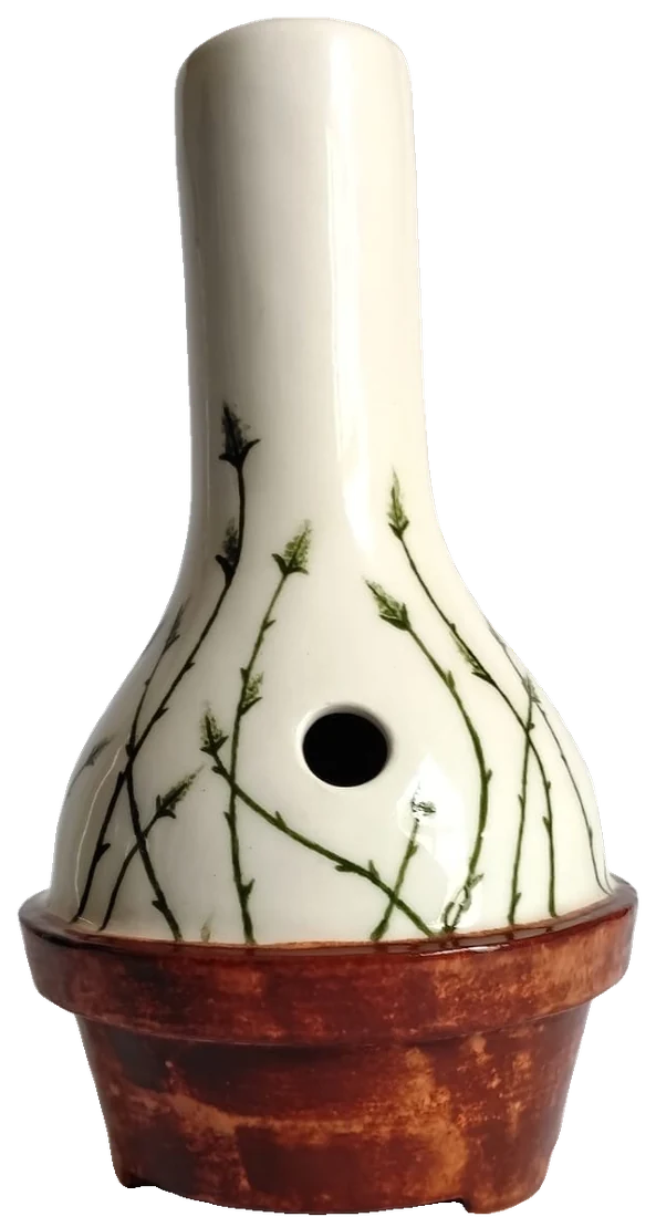 No. 03, Cape reed: a porcelain body painted with slender reed stems and seed heads, set in a terracotta-glazed pot
